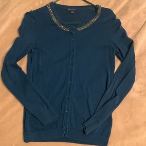 Blue-green cardigan with jem detail at collar